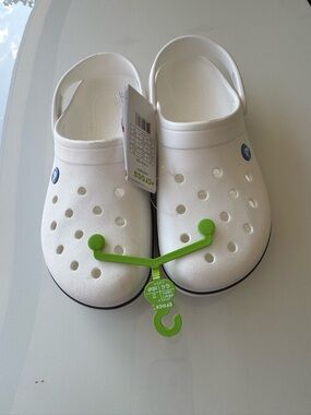 Brand new CROCS women size 11 men size 9
